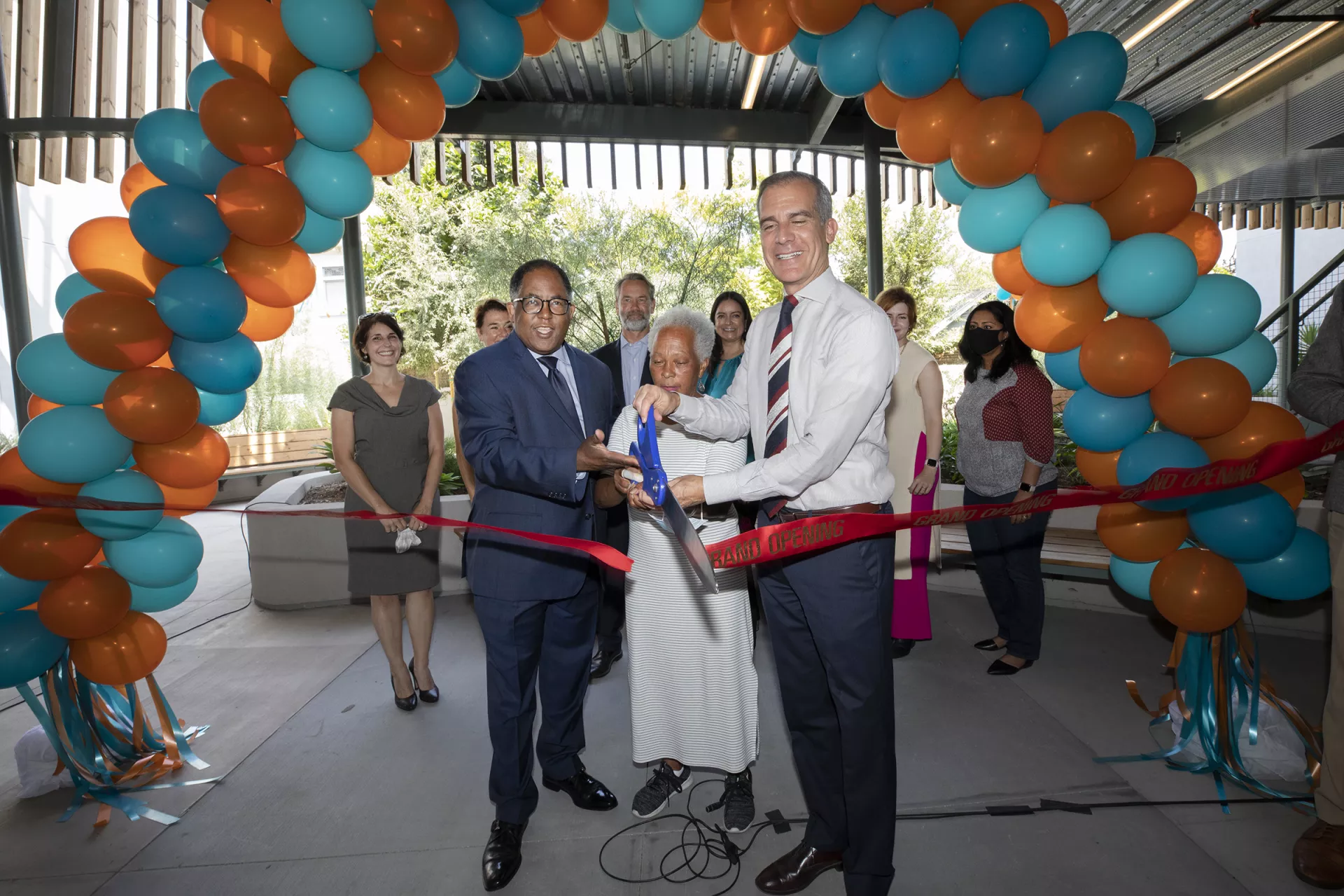 Group ribbon cutting for gramercy apartments